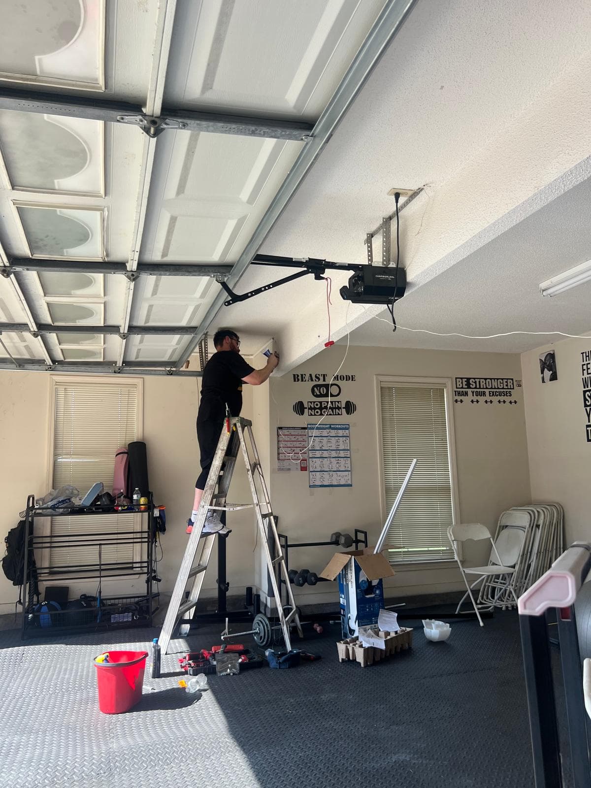 V&M technician completing a residential garage door opener installation